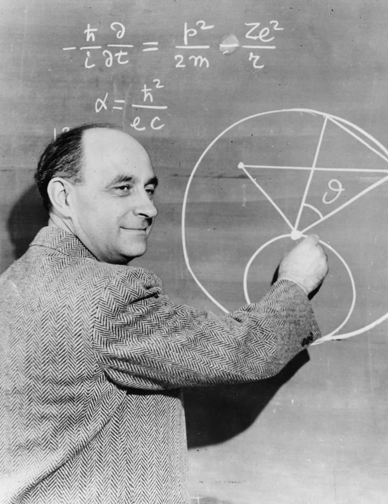 Italian-born physicist Enrico Fermi (1901-1954) at the chalkboard