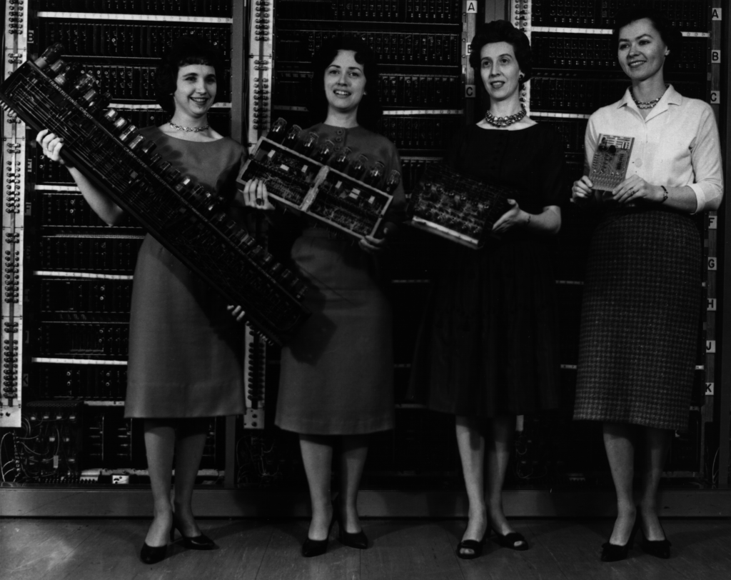 US Army Photo (163-12-62) Patsy Simmers, Gail Taylor, Milly Beck, and Norma Stec with parts from ENIAC, EDVAC, ORDVAC, and BRLESC-I