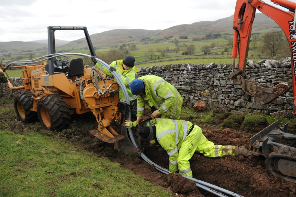 BDUK Cumbria Fell End11 - Engineers laying a cable as part of a community dig near Fell End Cumbria